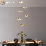 Modern gold crystal sand staircase chandelier with sleek pendant lights enhances dining room decorbites crystal sand design