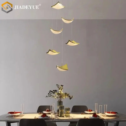 Modern gold crystal sand staircase chandelier with sleek pendant lights enhances dining room decorbites crystal sand design