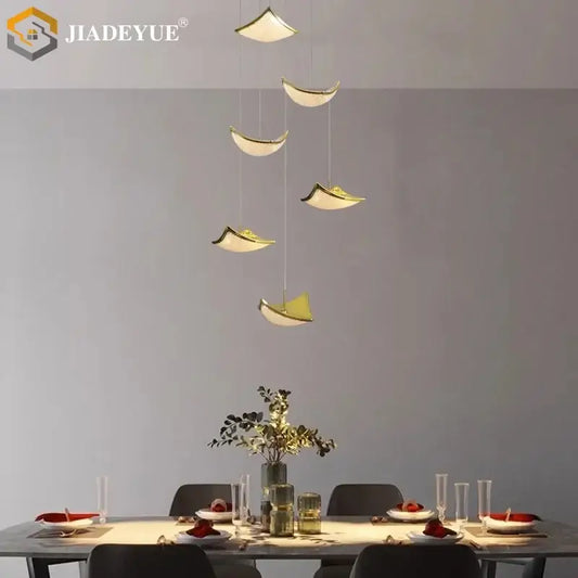 Modern gold crystal sand staircase chandelier with sleek pendant lights enhances dining room decorbites crystal sand design
