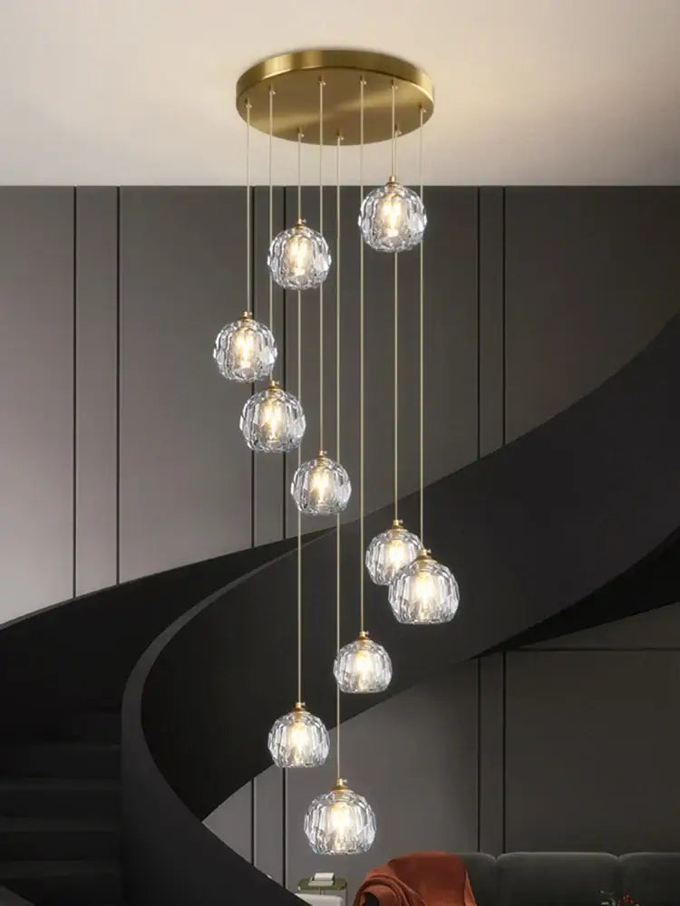 Modern gold crystal stair football shaped chandelier with circular mount and dangling crystal globe pendants for stairwell decorbites crystal stair
