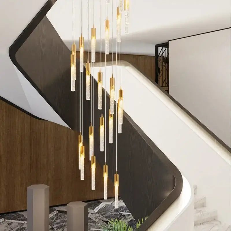 Modern gold crystal staircase chandelier with clear glass pendants and sleek cascading design by decorbites crystal stairwell lamp