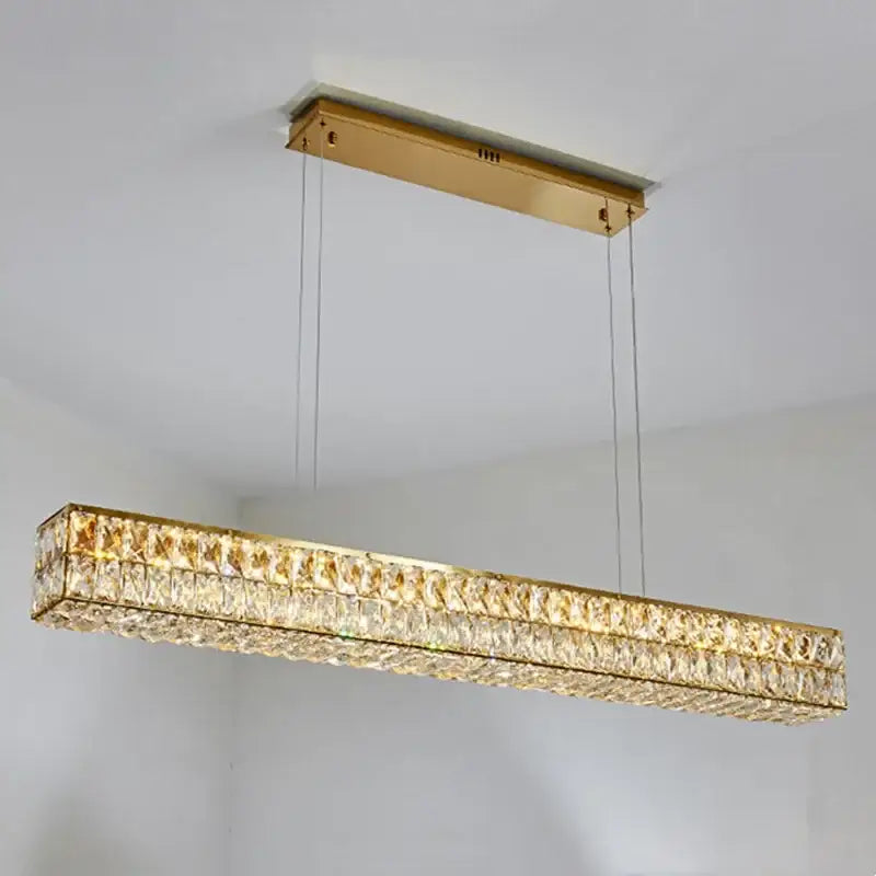Modern gold crystal steel led pendant light featuring a rectangular design with faceted clear crystals for dining room decorbites crystal steel