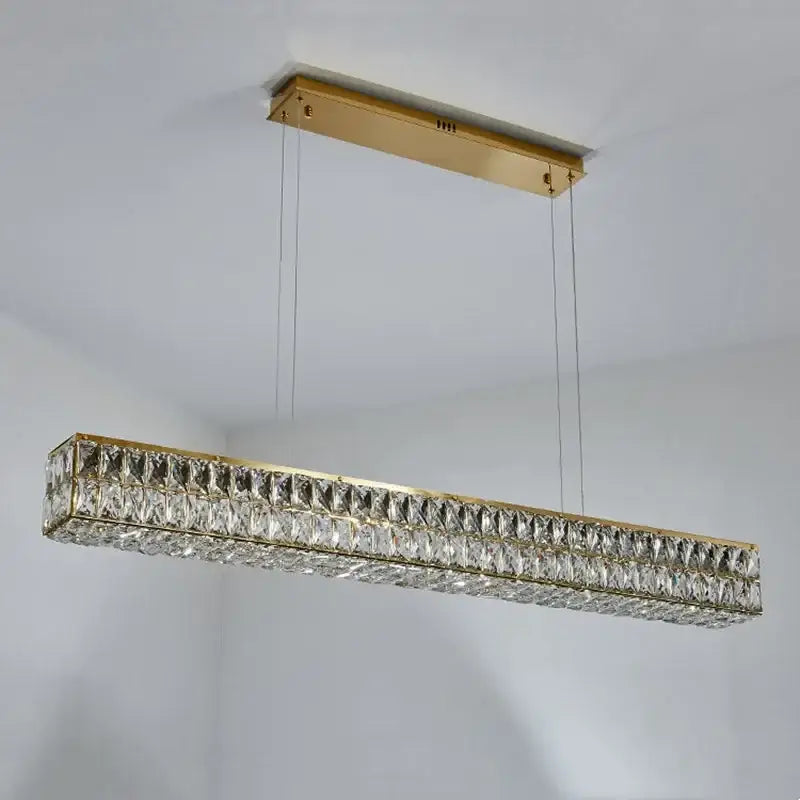 Modern gold crystal steel led pendant light featuring clear faceted crystals for elegant dining room decorbites crystal steel design
