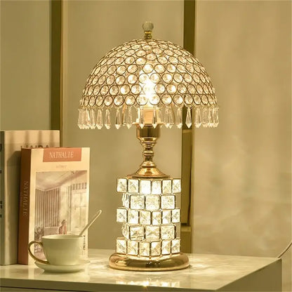 Modern gold crystal table lamp with faceted dome top, teardrop chandeliers, square base, and dimmer remote control decorbites crystal table
