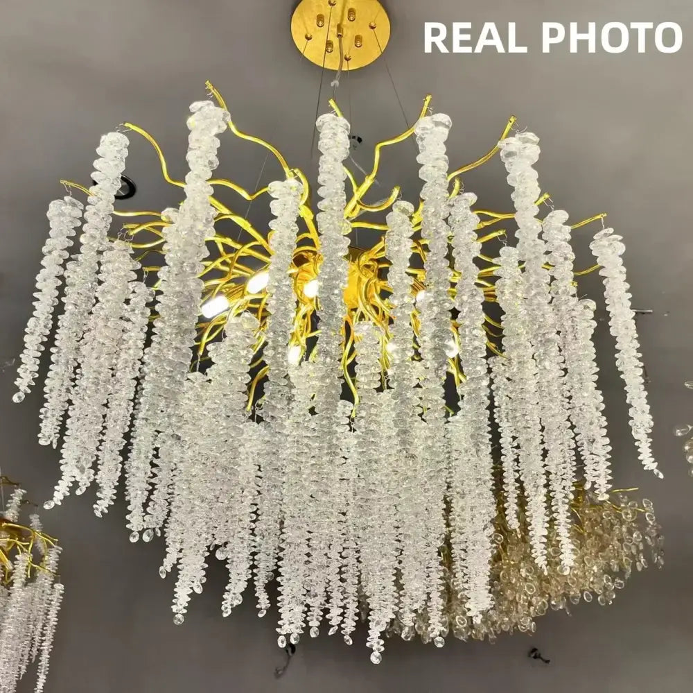 Elegant modern gold crystal tassel led pendant light with cascading clear glass beads and twisted metal arms for dining room decorbites crystal tassel chandelier