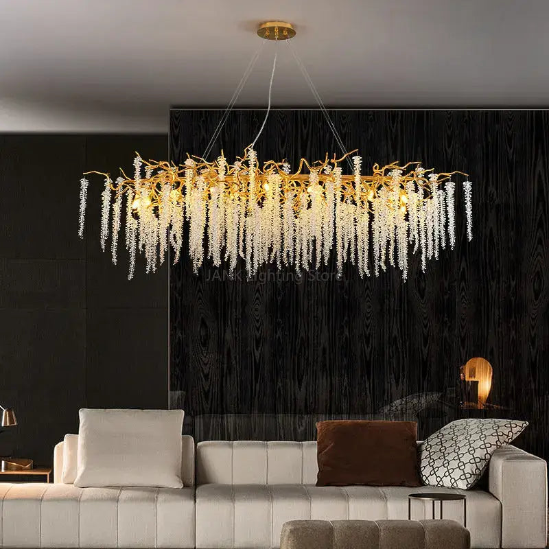 Modern gold crystal tassel pendant chandelier featuring a golden branch design with cascading clear crystal droplets