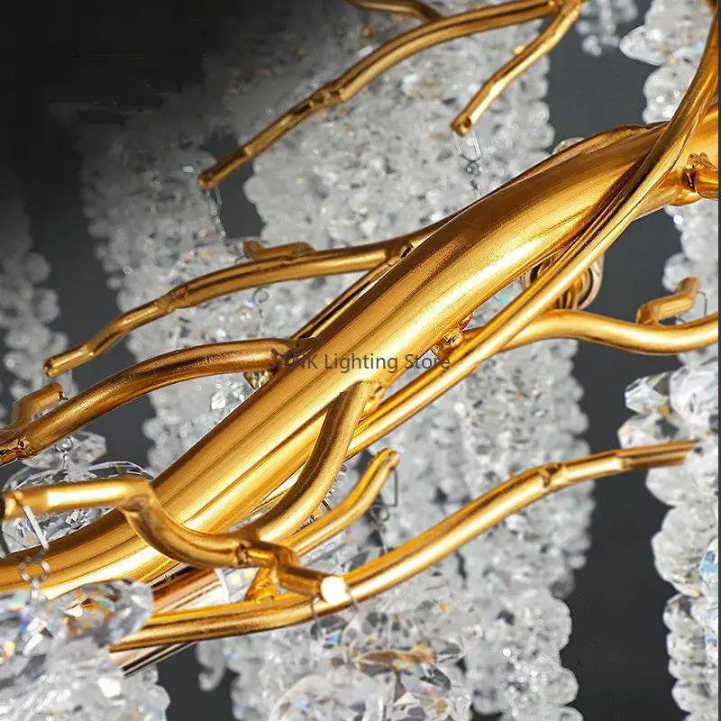 Modern gold crystal tassel pendant chandelier featuring intricately twisted metal branches with clear crystal accents for dining room lighting decorbites crystal tassel