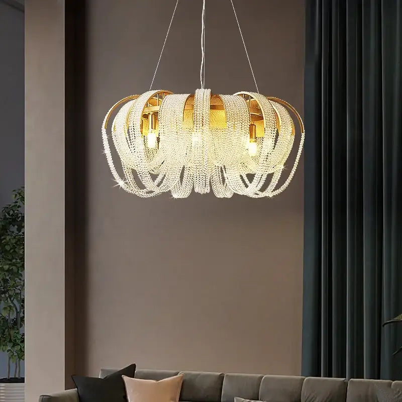 Modern gold crystal tassels led chandelier featuring cascading clear crystal tassels for dining room decorbites decor