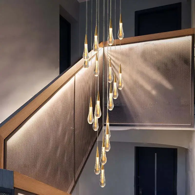 Modern gold crystal tear drop led pendant light with teardrop glass bulbs suspended by gold rods for dining room decorbites crystal tear