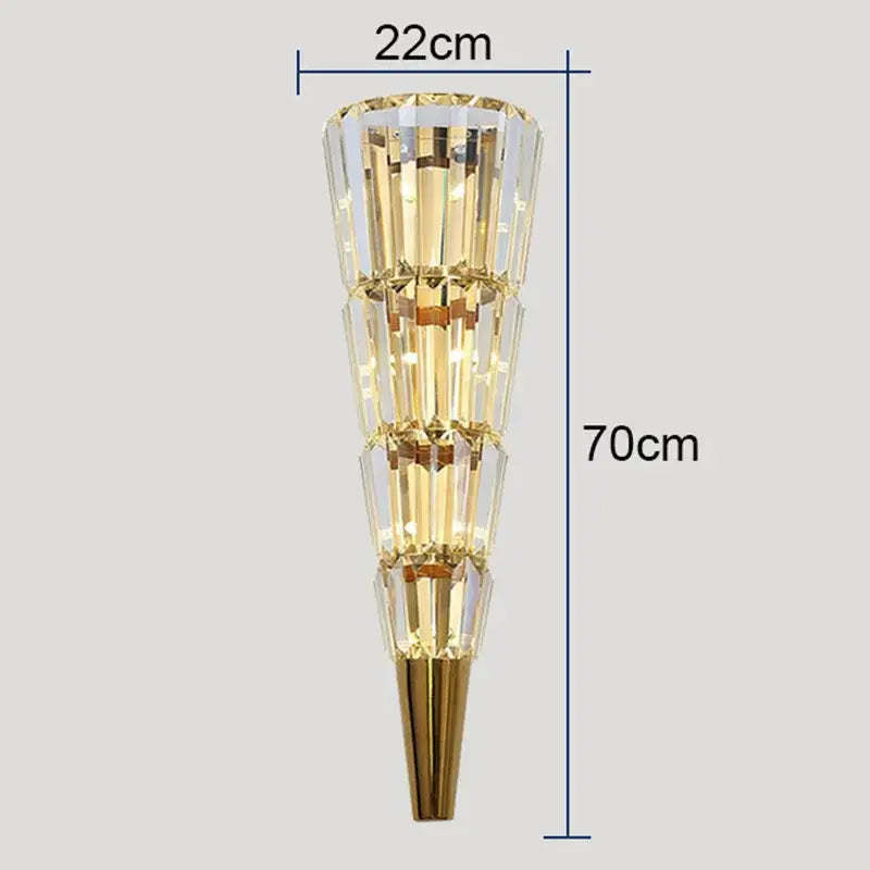 Modern gold crystal torch wall lamp with tiered crystal facets emitting warm glow for elegant living room decorbites wall lamp