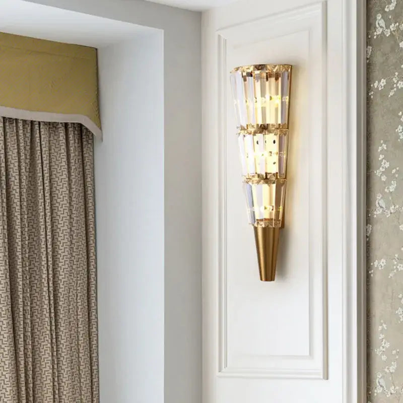 Modern gold wall lamp with stacked crystal torch segments and conical base for living room decorbites crystal torch wall
