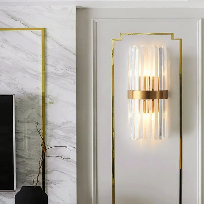 Modern gold crystal wall lamp featuring vertical glass rods and warm light for elegant bedroom decorbites crystal wall use