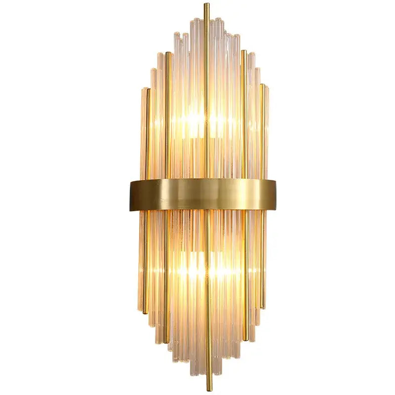 Modern gold crystal wall lamp featuring vertical glass tubes in a radiant fan pattern for elegant bedroom decorbites crystal wall sconce