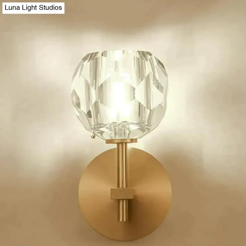 DecorBites ivy crystal wall lamp featuring a clear faceted crystal globe with brushed brass base and stem