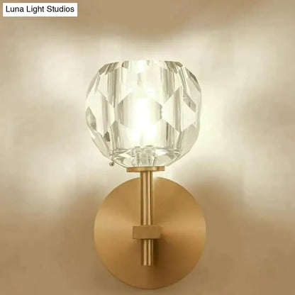 DecorBites ivy crystal wall lamp featuring a clear faceted crystal globe with brushed brass base and stem