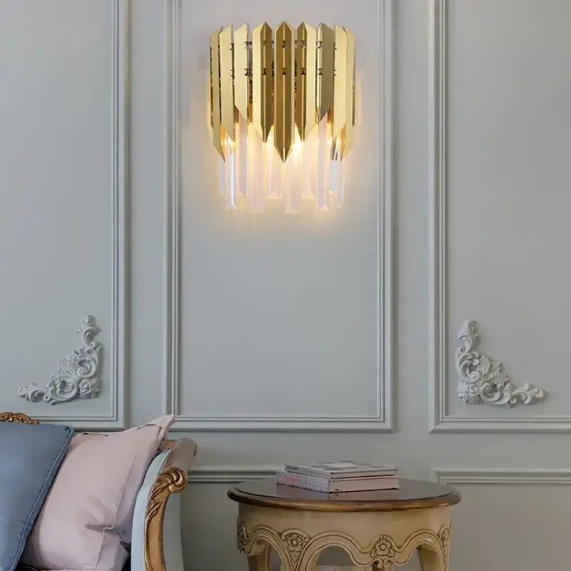 Modern gold crystal wall lamp with vertical metallic slats and hanging crystal accents for elegant decorbites crystal wall lighting