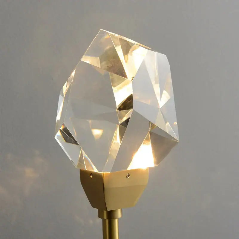 Modern gold crystal wall lamp with faceted crystal lampshade and gold-toned metal base for bedroom decorbites crystal wall