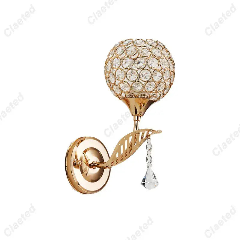 Modern gold wall lamp featuring a spherical crystal globe and dangling teardrop for elegant bedroom decorbites crystal wall use