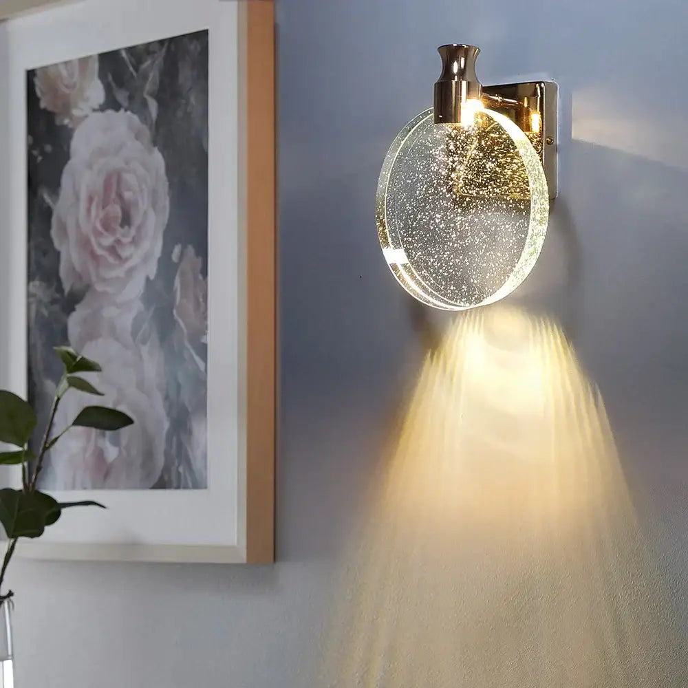 Modern gold crystal wall lamp with clear glass shade and sparkling diffuser for warm bedroom lighting decorbites wall lamp