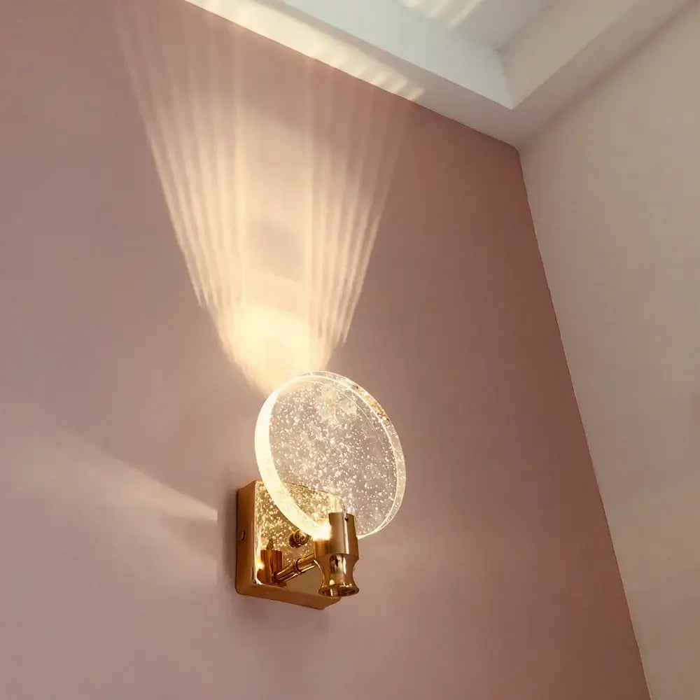 Modern gold crystal wall lamp featuring a clear glass bubble shade ideal as a decorbites crystal wall lamp for bedrooms