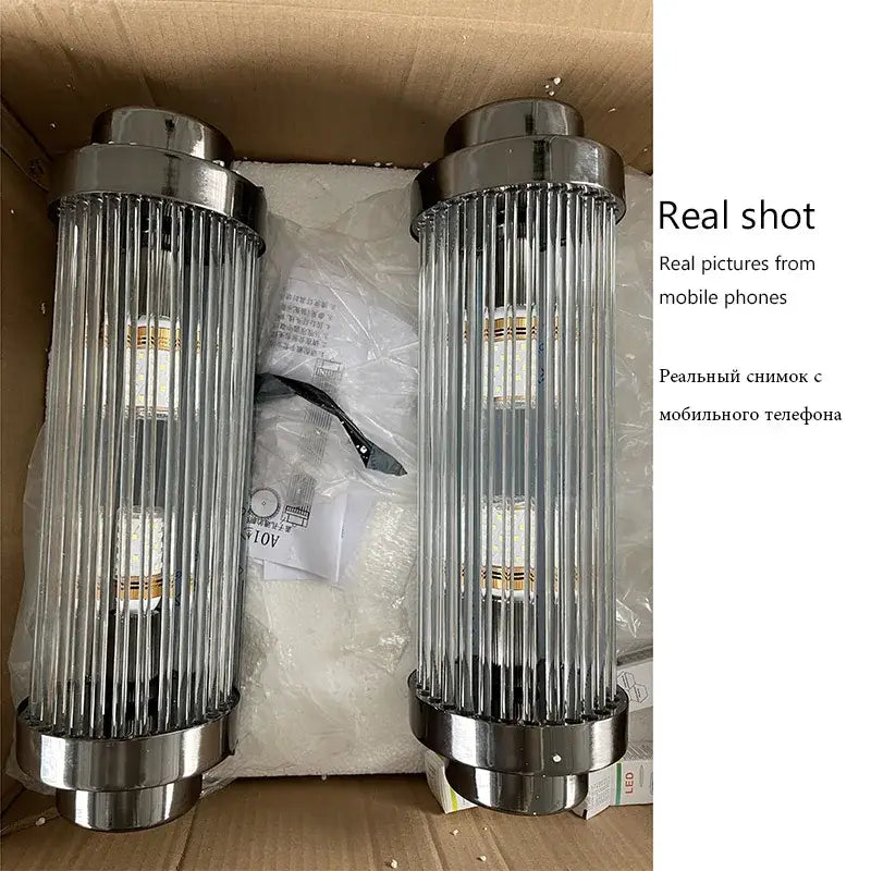 Two sleek cylindrical crystal wall lamps with polished chrome and vertical glass rods for modern bedroom decorbites wall lamp