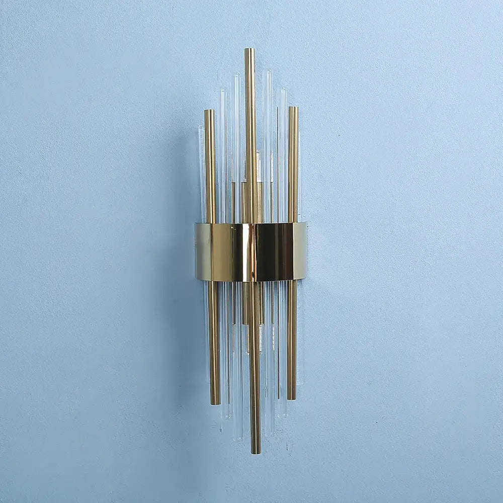 Modern gold crystal wall lamp featuring vertical clear glass rods radiating from a central metallic band for bedroom decorbites crystal wall lamp