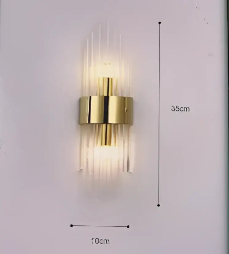 Modern gold crystal wall lamp with vertical glass tubes and a central cylindrical fixture for bedroom decorbites crystal wall lamp