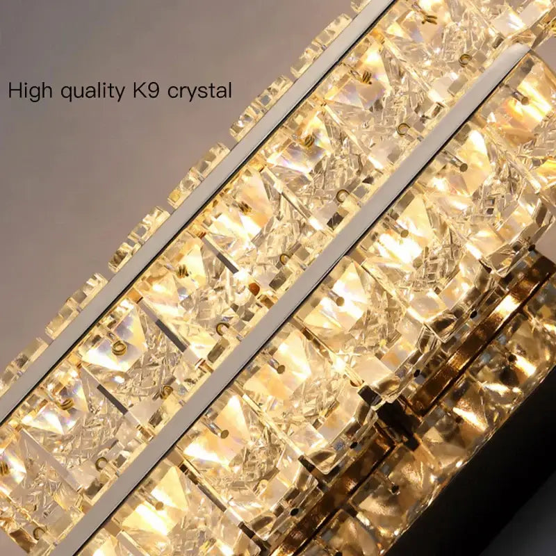 Modern gold crystal wall lamp featuring k9 crystal prisms and metallic accents for elegant living room decorbites lighting