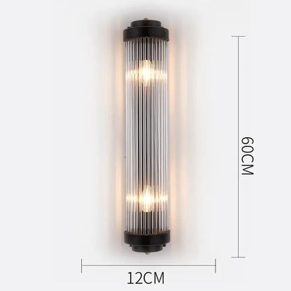 Modern gold crystal wall lamp featuring black-framed glass sconce with vertical tubes and warm glowing bulbs