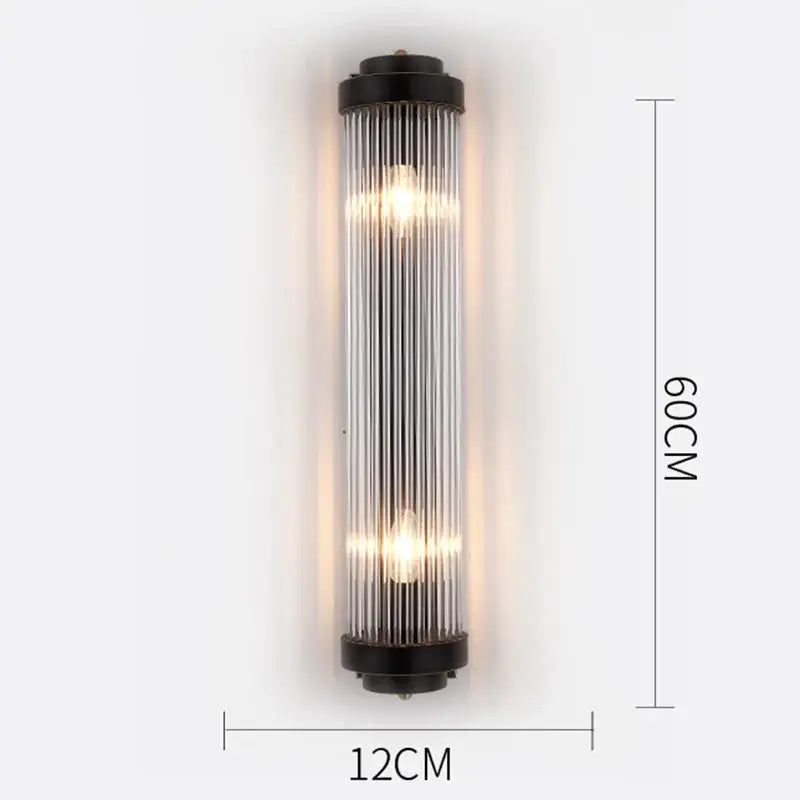 Modern gold crystal wall lamp featuring black-framed glass sconce with vertical tubes and warm glowing bulbs