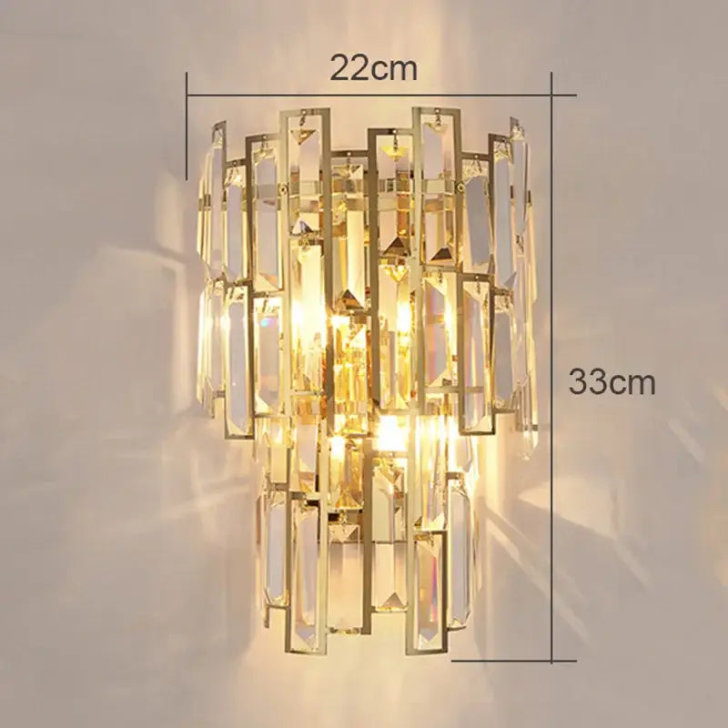 Modern gold crystal wall lamp with cascading rectangular crystal prisms in a tiered design for living room use