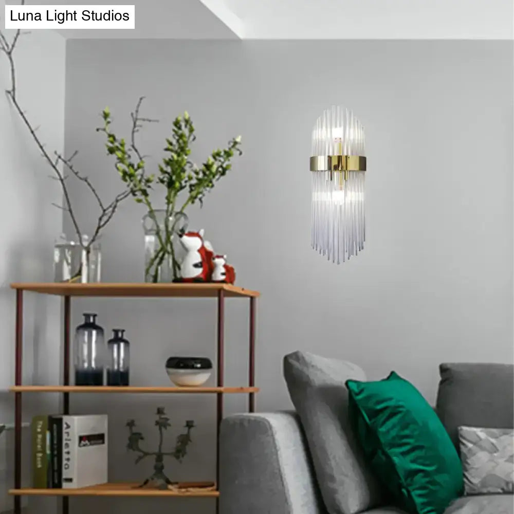 Modern gold crystal wall lamp with a metal frame and vertical glass prisms for living room lighting