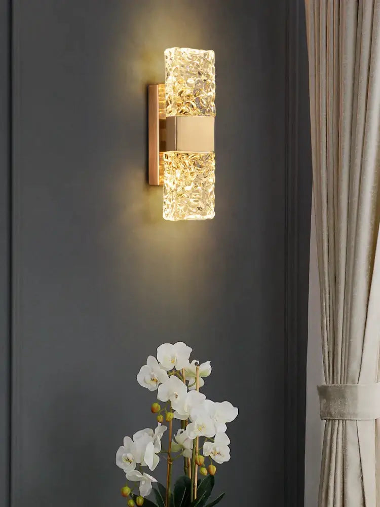 A modern gold crystal wall lamp with textured glass and metal accents perfect for living room decorbites crystal wall use
