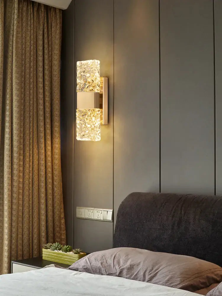 Modern gold crystal wall lamp with textured glass and brushed metal frame for elegant living room decorbites crystal wall lighting