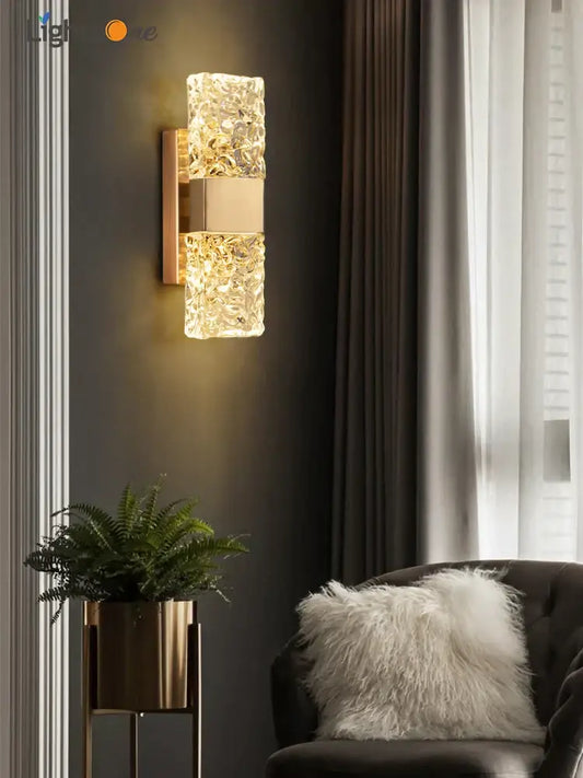 Modern gold crystal wall lamp with textured glass sconce emitting warm light perfect for living room decorbites crystal wall