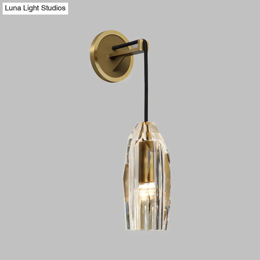 Modern gold crystal wall sconce with direct wired electric installation featuring faceted crystal shade and black arm