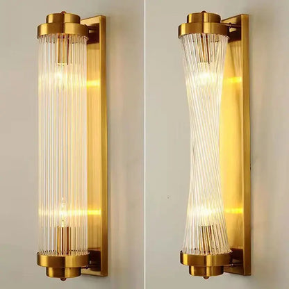 Modern gold crystal wall sconce with vertical glass rods in straight and curved design by decorbites crystal wall lighting
