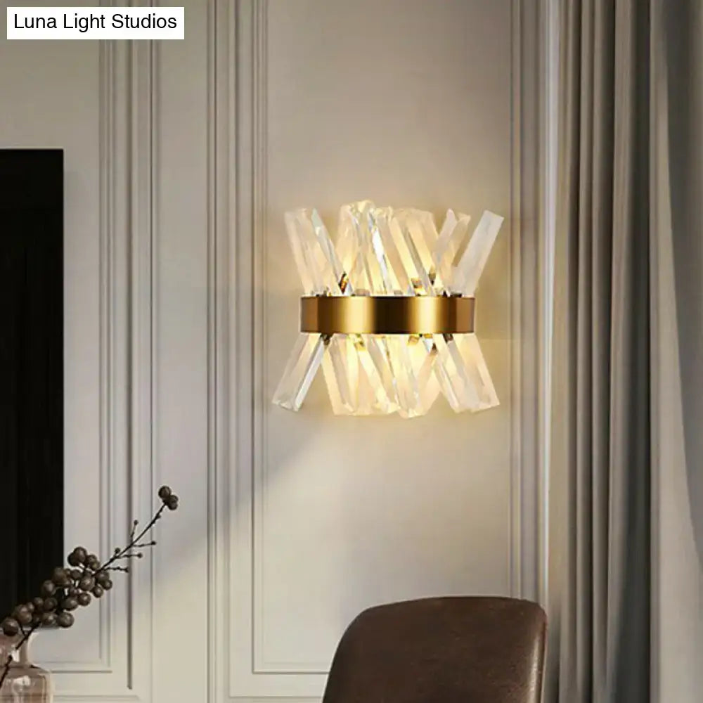 Modern gold crystal wall sconce with clear faceted rods radiating from a circular base for bedroom wall mount lamp