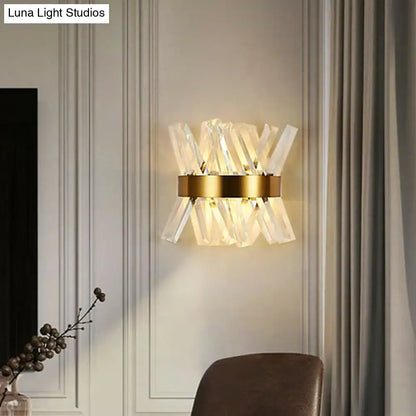 Modern gold crystal wall sconce with clear faceted rods radiating from a circular base for bedroom wall mount lamp