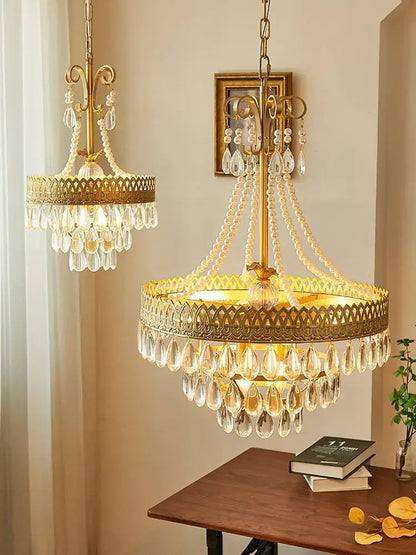 Modern gold crystal water drop chandelier with intricate filigree and cascading clear crystal water drop teardrops