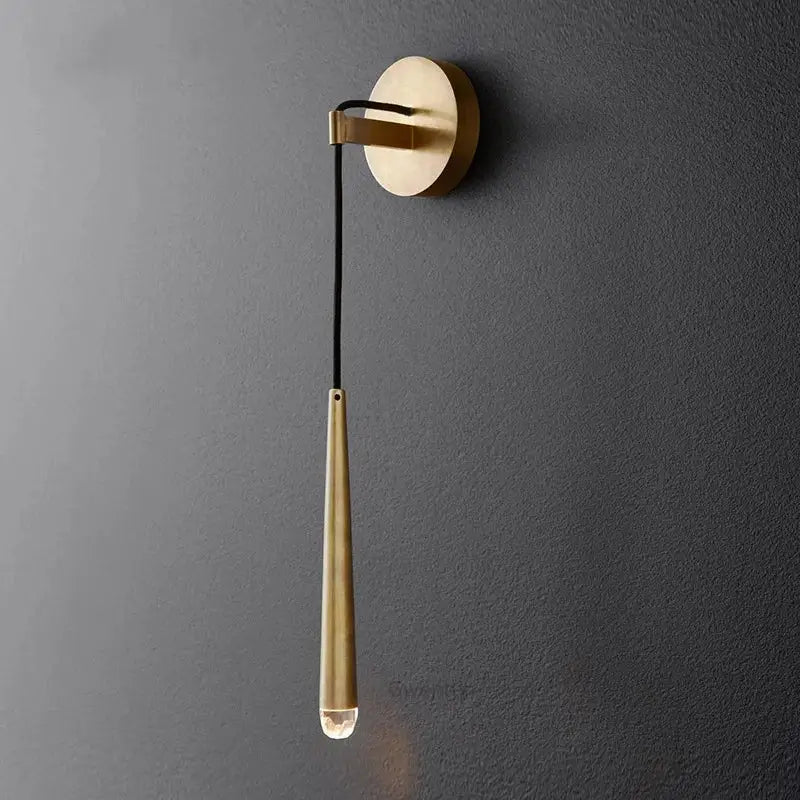 Modern gold crystal water drop wall sconce with sleek teardrop metal body and clear glass bulb for bedroom decor