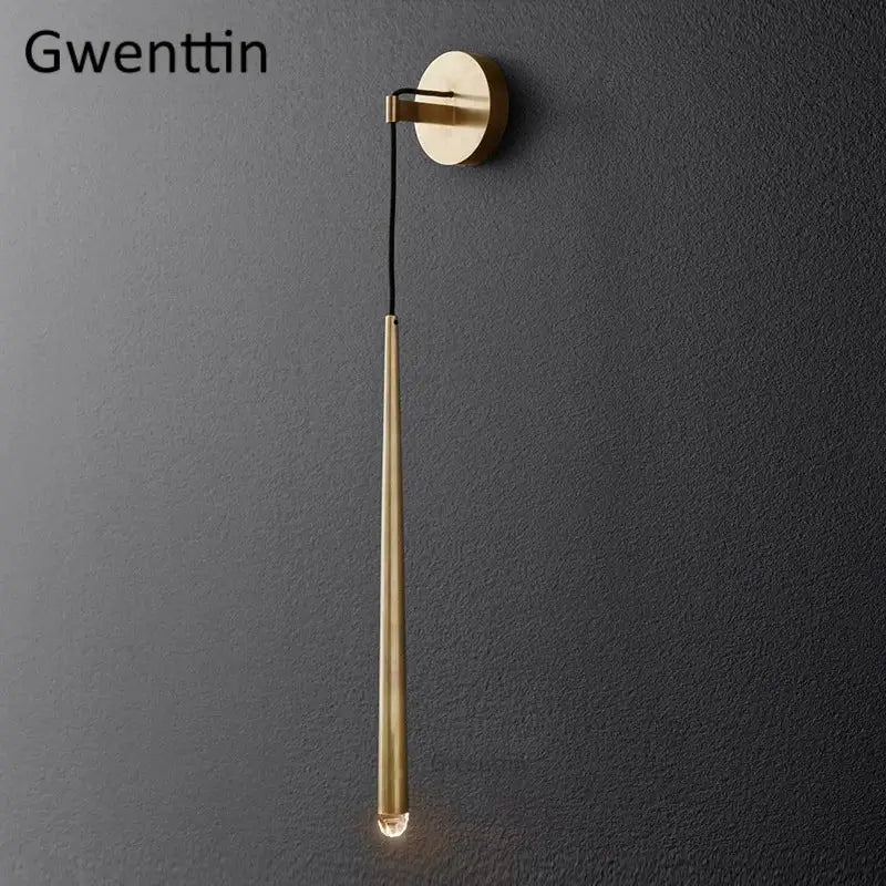 Modern gold crystal water drop wall sconce with sleek brass cylindrical design and warm glowing bulb for bedroom decorbites crystal water drop lighting