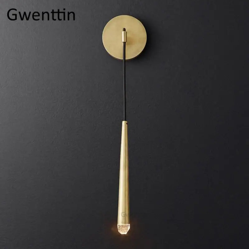 Modern gold crystal water drop wall sconce with brass tapered stem and circular base for bedroom decorbites crystal water lighting