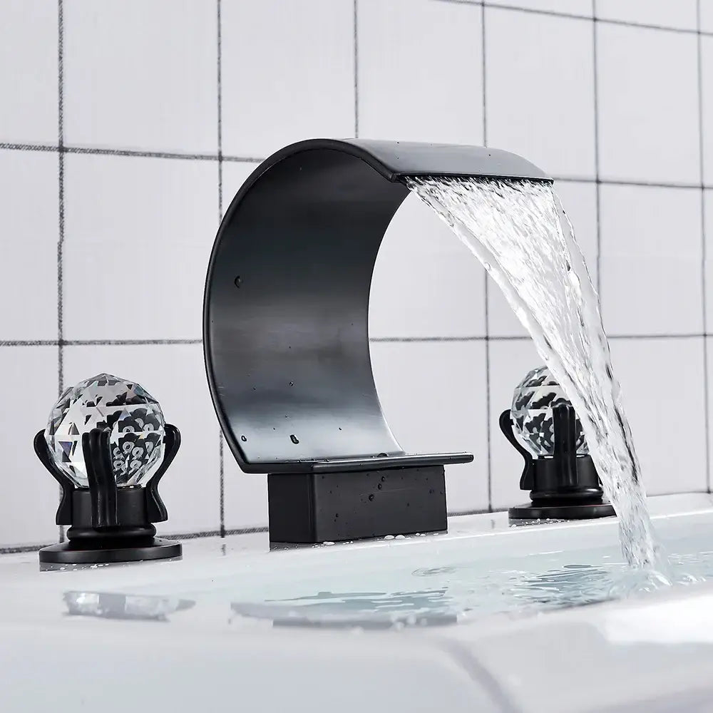 Black basin faucet with crystal globe handles featuring decorbites crystal waterfall design for modern bathroom sink