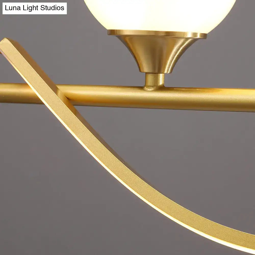 Modern gold curve island light pendant with gold-toned metal chandelier and frosted glass globe fixture