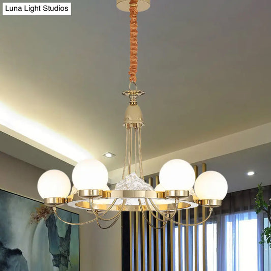 Lámpara de techo moderna dorada con brazos curvos - Lámpara colgante LED de metal de 6 luces con pantalla de cristal esmerilado