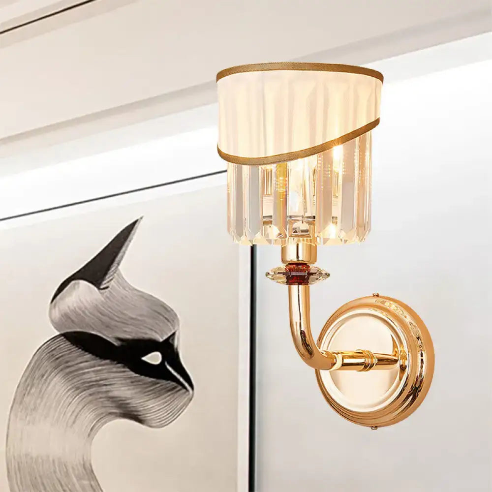 Modern gold curved arm wall light with e12 e14 fitting featuring a pleated cream shade and vertical crystal accents