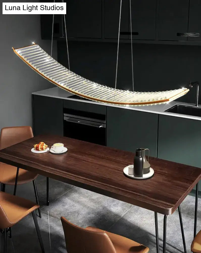 Modern gold curved crystal chandelier featuring a sleek translucent glass panel and warm led illumination for dining room suspended crystal chandelier