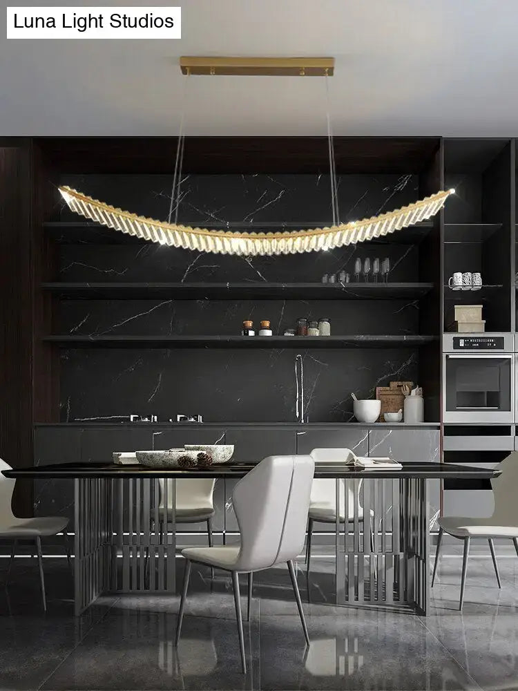 Modern gold curved crystal chandelier with layered translucent glass elements for dining room suspended crystal chandelier