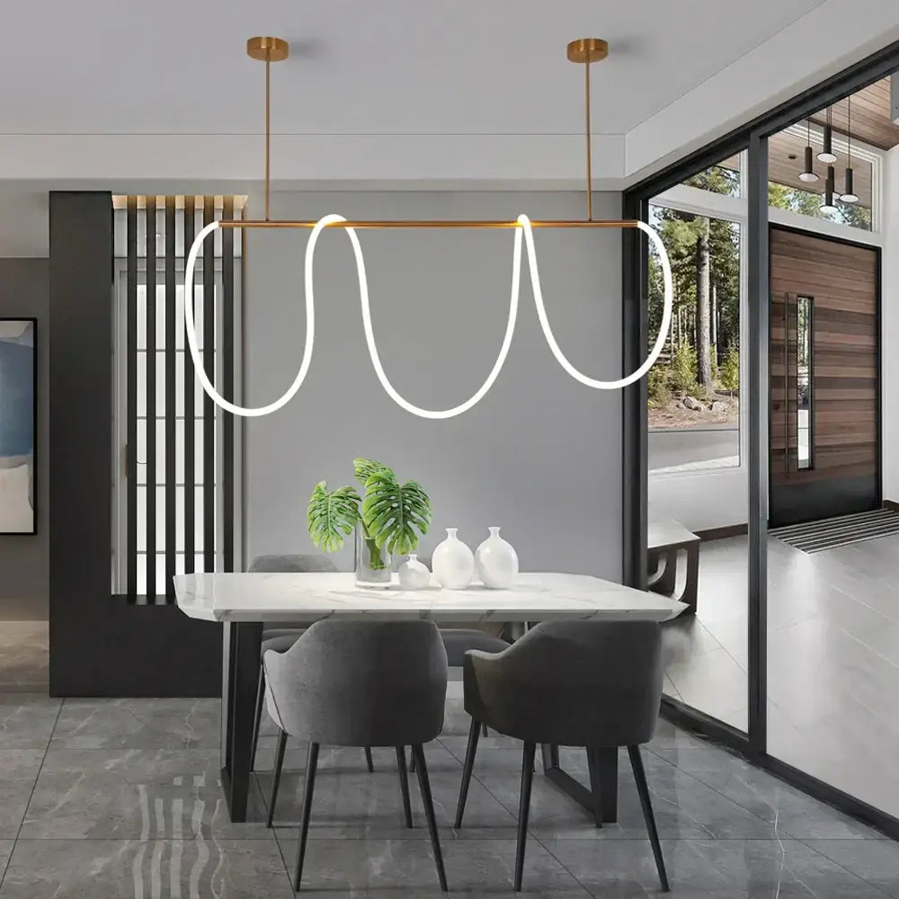 Modern gold curved led pendant lights with sleek white luminous led pendant and gold-toned fixtures for living room